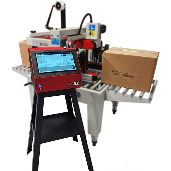 Norwix UC22 inkjet coding system printing on cartons at a case-taping station