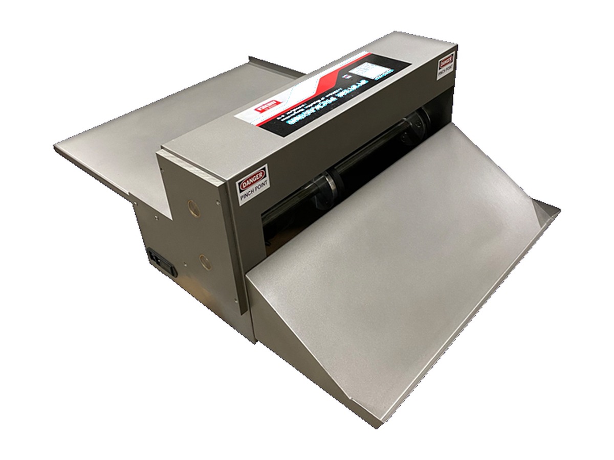 System Packaging Model 200 mini cold-seal machine