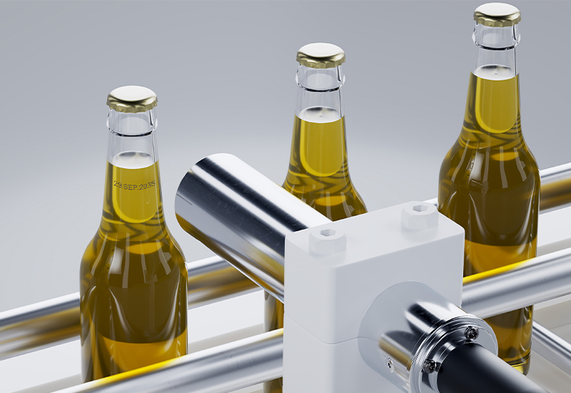 LEIBINGER IQJET continuous inkjet printer coding glass bottles on a production conveyor